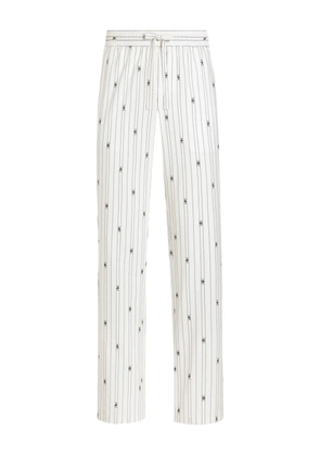 Dolce & Gabbana striped logo-print trousers - White