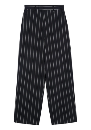Giuseppe Di Morabito logo-plaque trousers - Blue