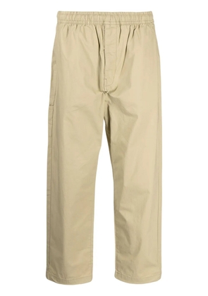 izzue logo-patch trousers - Neutrals