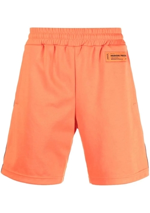Heron Preston logo tape track shorts - Orange