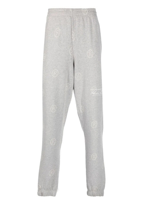 Martine Rose all-over logo-print track pants - Grey