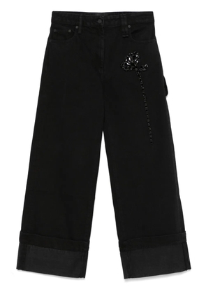 Simone Rocha Carnation-embellished jeans - Black
