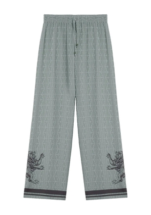 Domaine Des Artistes lion-embellished geometric-print pants - Blue