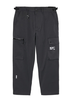 izzue logo-printed trousers - Grey