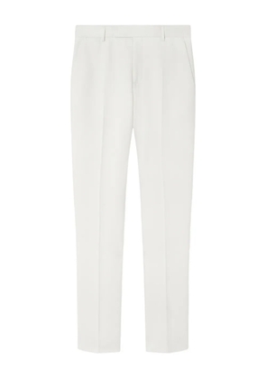 Versace logo-patch trousers - White