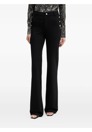 GUESS USA button-embellished trousers - Black