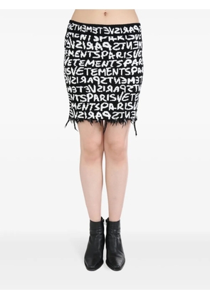 VETEMENTS Graffiti monogram skirt - Black