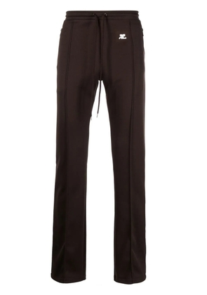 Courrèges logo-appliqué trousers - Brown