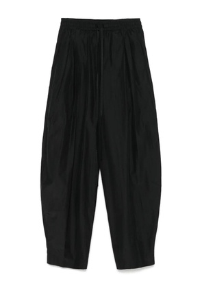 THE ANDAMANE pleat-detail trousers - Black
