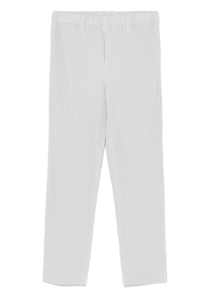 Homme Plissé Issey Miyake tapered trousers - Grey
