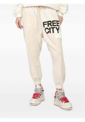 FreeCity logo-print track pants - Neutrals