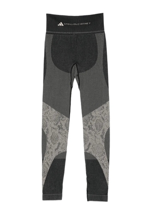adidas by Stella McCartney snake-print panelled trousers - Black