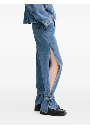 Won Hundred side-slit tied-cuffs denim jeans - Blue