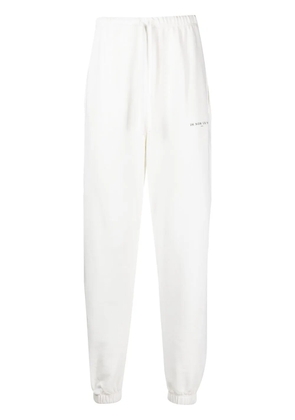 Ih Nom Uh Nit logo-print cotton track pants - White