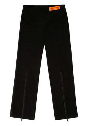 Heron Preston logo-patch zip-up trousers - Black