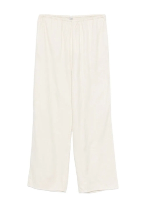 TOTEME monogram-pattern trousers - Neutrals