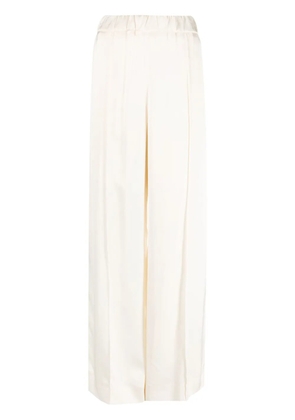 Jil Sander pressed-crease elasticated-waist flared trousers - Neutrals