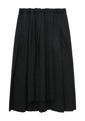 Black Comme Des Garçons pleated midi skirt