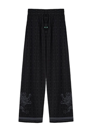 Domaine Des Artistes lion-embellished patterned silk trousers - Black