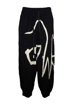 Haculla graphic-print wool trousers - Black