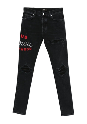 AMIRI embroidered distressed jeans - Black