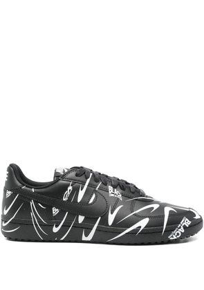 Black Comme Des Garçons graphic print trainers
