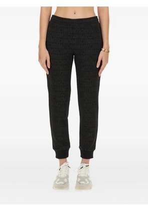 Moschino monogram-print track pants - Black