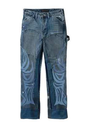 Who Decides War flame-pattern patched jeans - Blue