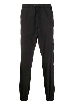COUNTY OF MILAN Cross tapered track pants - Black