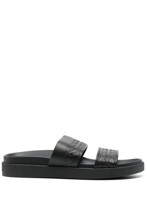 Calvin Klein embossed-logo leather slides - Black