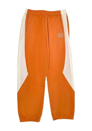 Sinclair Tech Logo panelled track pants - Orange