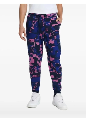 Nike abstract-print track pants - Blue