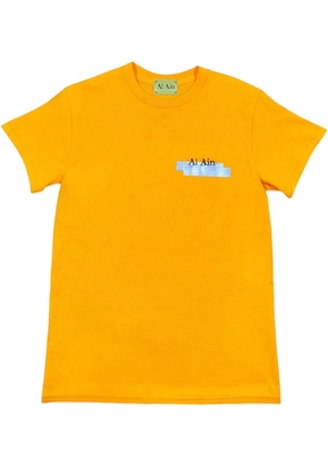 AL AIN graphic-print T-Shirt - Yellow