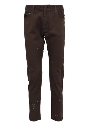 Undercover embroidered design jeans - Brown