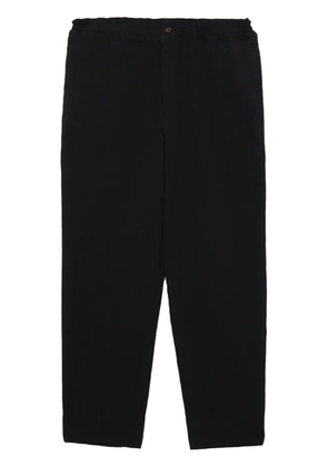 Black Comme Des Garçons cropped elasticated trousers