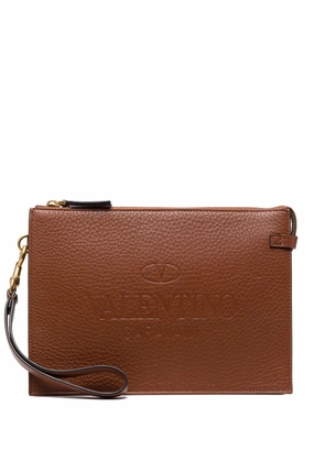 Valentino Garavani logo-embossed pebbled leather clutch - Brown
