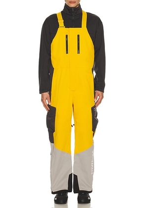 Whitespace 2L Insulated Cargo Bib Pant in Golden Yellow  Rock Ridge  & Phantom - Yellow,Black. Size L (also in M, S, XL/1X, XXL/2X).