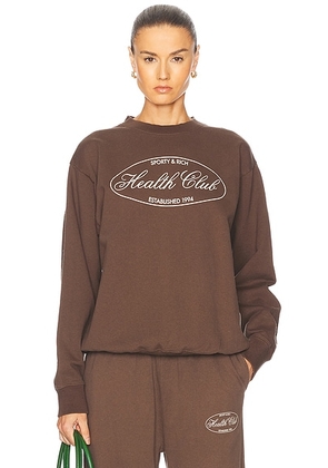 Sporty & Rich Oval Health Crewneck Sweater in Chocolate - Brown. Size L (also in ).