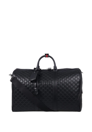 Gucci medium logo-embossing luggage duffle - Black