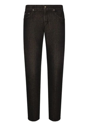 Dolce & Gabbana logo-appliqué long-length tapered jeans - Black