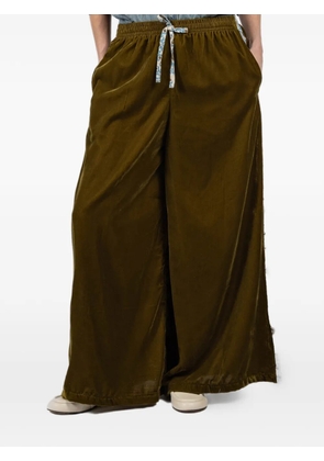 FISH CLUB floral-trim disco trousers - Green