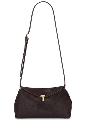 Toteme T-Lock Pony Hair Clutch in Wine - Wine. Size all.