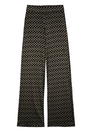 Stine Goya Magic logo-print high-rise trousers - Black