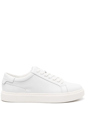 Calvin Klein logo-debossed leather sneakers - White