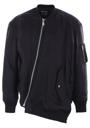 Black Comme Des Garçons reversible asymmetric bomber jacket.