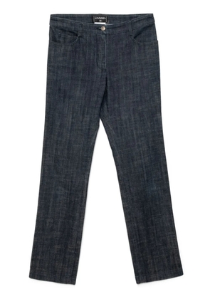 CHANEL Pre-Owned 2005 logo patch denim trousers - Blue