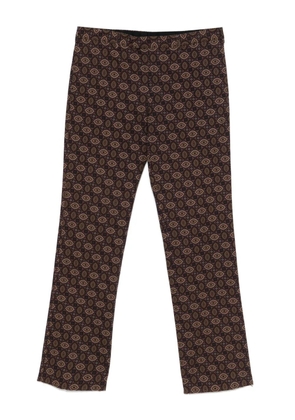 Prada Pre-Owned 2010s kaleidoscopic-print trousers - Brown