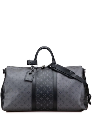 Louis Vuitton Pre-Owned 2021-2025 Monogram Eclipse Reverse Keepall Bandouliere 50 travel bag - Black