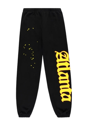 SP5DER Atlanta graphic track pants - Black