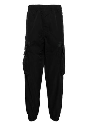 AAPE BY *A BATHING APE® logo-appliqué tapered cargo trousers - Black